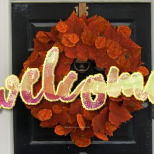 Fall Wreath Video - a front door with a welcoming wreath made of bright fall leaves