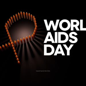 World AIDS Day Worship Service Video - the words "World AIDS Day" next to a red ribbon formed by several lit candles