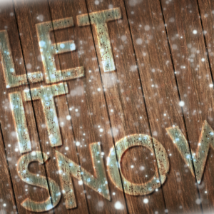 Let It Snow Video. Snowflakes fall on a wooden deck.
