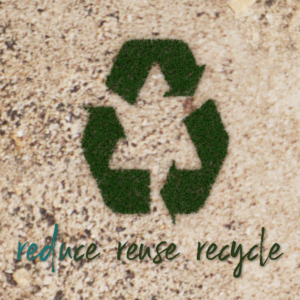 Reduce Reuse Recycle Social Media. Blades of grass grow out of the ground and form the familiar recycle symbol.