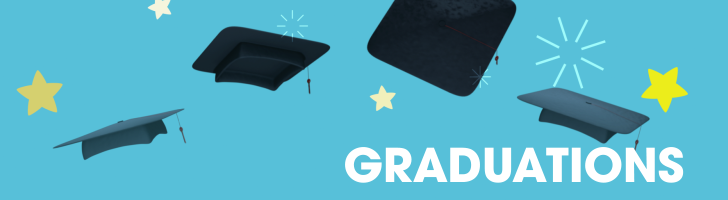 Graduation hats thrown into the air in celebration