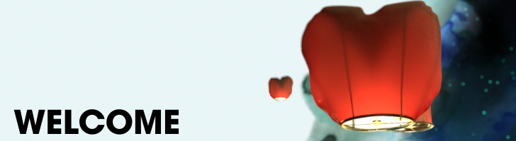 Heart-shaped lanterns drift upward into the sky