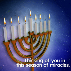 Hanukkah. A menorah with lit candles against a dark starry sky.