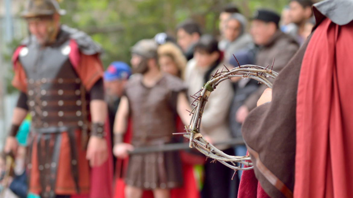 Closer-up of a crown of thorns, being held by a person in a Semana Santa parade.